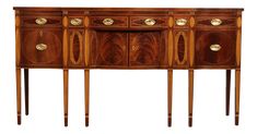 an antique wooden sideboard with three drawers and two brass pulls on the doors,