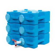 several blue plastic barrels stacked on top of each other