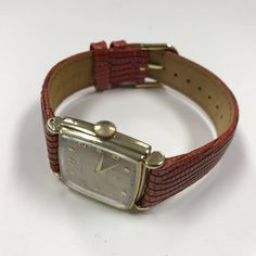 "d054 Vintage Original Hamilton 747 17 Jewels 14k Gold Filled Men's Wrist Watch PLEASE READ ENTIRE DESCRIPTION BEFORE PURCHASING Please see pictures for more details! Pre-owned: Some scratches from normal wear. Face shows some discoloration. Please see photos for details. Watch is working and keeping time well. Watch is in great mechanical condition, all of our watches are tested for time by one of our watchmakers before being listed for sale. Sold as is, no returns for antique/vintage items Spe Classic Red Watch For Formal Occasions, Classic Red Watches For Formal Occasions, Classic Red Formal Watch, Classic Red Watch Bands For Business, Classic Red Watch Bands For Formal Occasion, Classic Red Watch Bands, Vintage Red Watch Accessories For Formal Occasions, Mechanical Hand, Authentic Watches