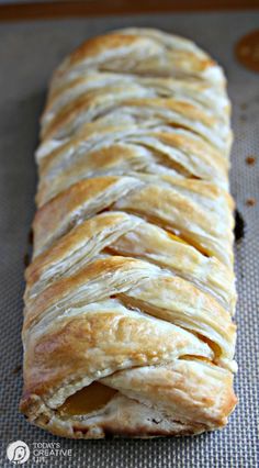 a long pastry sitting on top of a baking sheet