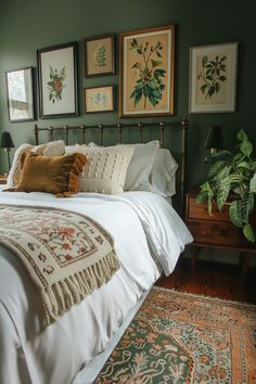 Cozy sage green bedroom with botanical artwork, white bedding, and vintage rug, showcasing calming bedroom colors and decor inspiration. Sage Green Bedroom Walls, Green Bedding Bedroom, Green Bedroom Walls, Green Bedroom Ideas, Dark Sage Green, Green Accent Walls