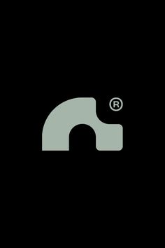 a black and white logo with the letter n in it's center, on a dark background