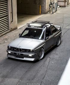 a silver car parked on the side of a road