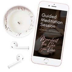 the guided meditation session on an iphone next to ear buds and a cup of coffee