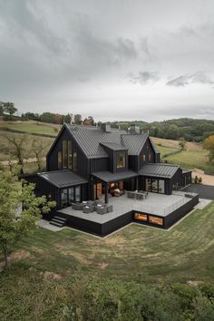 an aerial view of a modern house in the countryside