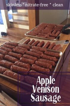 two trays filled with food sitting on top of a wooden table next to each other