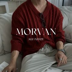 a man sitting on top of a couch wearing a red sweater and white pants with the words morvan