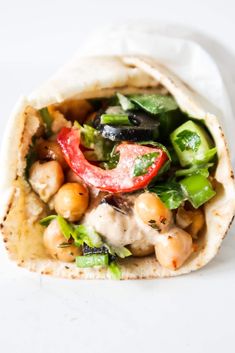 a pita filled with chicken and vegetables