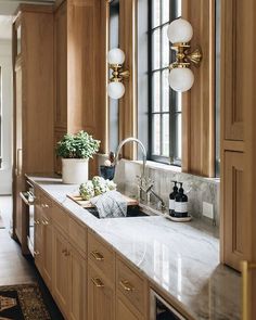 the instagram page on instagram com shows an image of a kitchen with wooden cabinets and marble counter tops