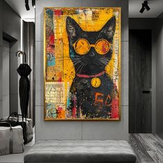 a black cat with yellow glasses on it's face in front of a painting