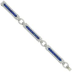 An Important Art Deco sapphire and diamond bracelet by Yard, consisting of three rectangular-shape flexible panels, each with a central row of calibre-cut sapphires surrounded by a diamond-set border of geometric design, connected by three oval-shaped diamond-set links, the sapphires estimated to weigh 10 carats in total, the old brilliant-cut diamonds estimated to weigh 11 carats in total, all mounted in platinum, signed Yard, circa 1930, measuring approximately 19 x 1.2cm, gross weight 34 grams. An Art Deco sapphire and diamond platinum bracelet in very good condition. Unmarked, bracelet tested as platinum and 18ct gold clasp tongue. This splendid Art Deco bracelet comes from the collection of Bentley & Skinner, the London jewellers by appointment to both Her Majesty the Queen and His Ro Bracelets Tennis, Bracelet Art, Bvlgari Jewelry, Sophisticated Art, Platinum Bracelet, Bracelet Tennis, Vintage Tennis, Art Deco Bracelet, Art Deco Diamond Rings