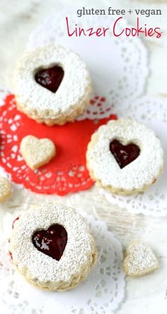 heart shaped cookies on a doily with the words gluten free and vegan