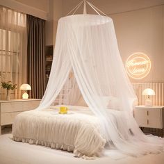 a bed with a white canopy over it