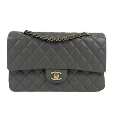 CHANEL - NEW 22A Classic Medium Double Flap Dark Grey CC Shoulder Bag Description * From Chanel's Fall Winter 2022 collection * Crafted with dark grey quilted leather and silver-toned hardware throughout. * The flap opens using an interlocking CC turn-lock to a slip pocket, a zipper pocket, and to another flap inside. * The second flap opens using a button closure to two compartments Measurements * Width: 10 in / 25.4 cm * Height: 6 in / 15.24 cm * Depth: 2.5 in / 6.35 cm * Strap Drop: 9 (double) 16 (Single) in / 22.86 cm Details * Made In: France * Color: Dark Grey * Accessories: Dust Bag, Care Cards * Material: Lambskin leather Condition * New w/ Tags * New with tags This item has been used and may have some minor flaws. Before purchasing, please refer to the images for the exact conditi Grey Accessories, Classic Chanel, Gray Accessories, Winter 2022, Chanel Bags, Classic Flap, Quilted Leather, Flap Bag, Lambskin Leather