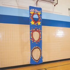 an all star sign in the middle of a gym with blue and yellow tile walls