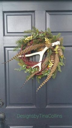 a wreath with scissors and greenery on the front door