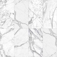 white marble tiles with grey veining on the edges and bottom, all in different sizes