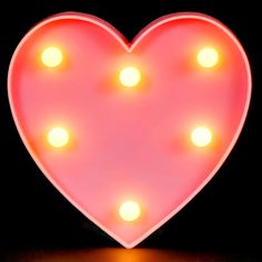 a heart shaped neon sign with lights on it