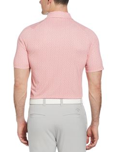 a man wearing a pink shirt and grey pants with his back turned to the camera