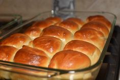 a glass baking dish filled with bread rolls