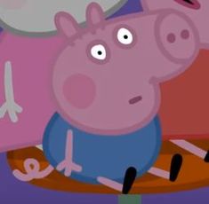 peppa pig sitting on top of a wooden table next to other cartoon characters in the background