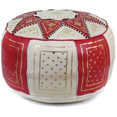 a red and white ottoman with gold trimmings on the top, sitting on a white surface