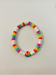 a colorful bracelet with a smiley face on it