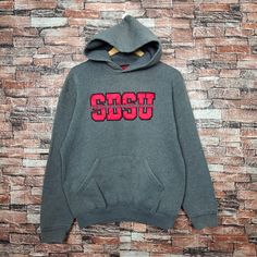 Vintage Distressed San Diego State University Sweatshirt San Diego Hoodie San Diego Pullover Embroidery Logo Gray Color Men's M Label : Black Label Collection Size : M(refer the measurement) Made In USA Materials from 50% Cotton 50% Polyester Used Item With Condition 5/10 Refer Picture. Distressed - Stain and Holes. Lay Down Flat Measurement : - Width (armpit to armpit) and: 22 Inches - Length (shoulder to end of garment): 25 Inches We are selling used clothing with good condition. DO NOT EXPECT the item is like new condition. Shipping: DHL/FEDEX EXPRESS with TRACKING NUMBER. Track and Trace http://www.dhl.com http://www.fedex.com Parcel will be arrive within 3-6 business days or more due to location and custom clearing. Please PROVIDE your PHONE/CONTACT NUMBER for SHIPPING/DELIVERY purpos Sporty Embroidered Long Sleeve Hoodie, Winter Hoodie With Embroidered Logo And Crew Neck, Red Hooded Hoodie With Embroidered Graphics, Red Hooded Sweatshirt With Embroidered Graphics, Winter Crew Neck Hoodie With Embroidered Logo, Winter Embroidered Logo Crew Neck Hoodie, Embroidered Sweatshirt For Streetwear In Winter, Red Embroidered Graphic Hoodie, Embroidered Sweatshirt For Winter Streetwear