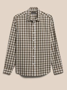 Crafted in a 100% cotton fabric that is expertly woven with different patterns on each side for an extra pop of print or contrasting color when you roll up your sleeves.  Double woven spread collar.  Button front.  Shirttail hem.  Standard fit.  Long Brown Printed Camp Collar Shirt, Classic Brown Button-up Flannel Shirt, Cotton Button-up Camp Shirt With All Over Print, Rugged Plaid Cotton Flannel Shirt, Black Shorts Men, Outdoor Cotton Button-up Flannel Shirt, Button Down Shirt Mens, Mens Button Up, Blue Denim Shorts