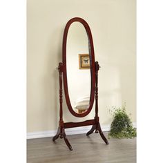 a large mirror sitting on top of a wooden stand