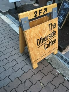 there is a sign that says the other side coffee