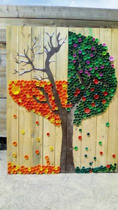 an image of a tree made out of bottle caps on a wooden fence with the words,