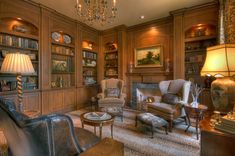 a living room filled with furniture and a chandelier