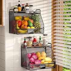 two metal shelves filled with different types of fruits and vegetables in front of a window