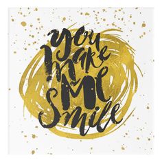 a card with the words you make me smile in black and gold paint on it