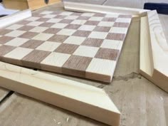 two pieces of wood sitting on top of a table