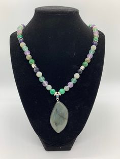 This posting is for ONE necklace with pendant ONLY. All stones are natural and un-dyed. All beads are 8mm. This necklace features Rainbow Fluorite, Labradorite and African Jade with a Labradorite Cabochon pendant. Pendant Size -  Approx. 2in (5.08cm) Rainbow Fluorite {Heart, Throat & Third Eye}- A highly protective and stabilizing stone. Cleanses mind, body, and spirit while promoting mental clarity. It releases negative thought patterns and helps one remain in the moment. An effective stone for Orange Mosaic, Rainbow Lollipop, Jewelry For Him, Rainbow Lollipops, Tree Of Life Earrings, Necklace With Pendant, Spirit Quartz, Druzy Necklace, Bee Necklace