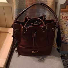 In Excellent Condition Brown Bucket Bag With Brass Hardware, Brown Bags With Gold-tone Hardware In Bucket Shape, Travel Bucket Bag With Brass Hardware, Chestnut Color, Dooney And Bourke, Dooney & Bourke Bags, Dooney & Bourke, Dooney Bourke, Chestnut