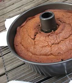 a chocolate cake in a metal pan on a table