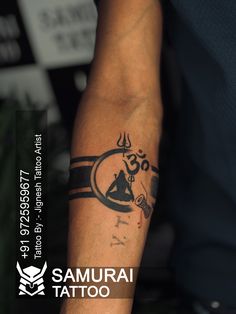 a man with a tattoo on his arm