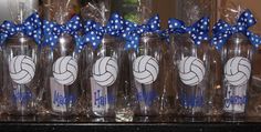 volleyball glasses with blue bows are lined up