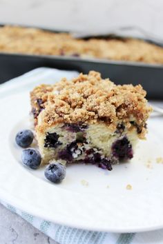 a piece of blueberry coffee cake on a plate