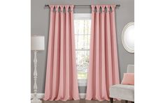 pink curtains hanging in front of a window