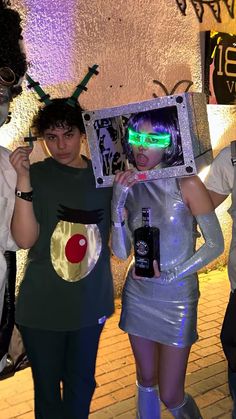 three people dressed up in costumes standing next to each other