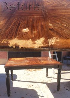 a wooden table with the words before painted on it