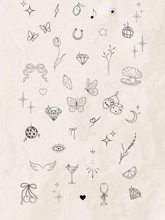 the back side of a white paper with black ink drawings on it, including stars and other