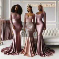 three women standing in front of a white couch wearing long sleeves and pink gowns