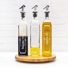 three bottles with different types of oils in them