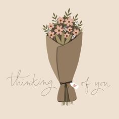 a bouquet of flowers wrapped in brown paper with the words thinking of you on it