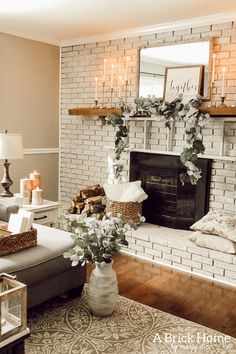 a living room filled with furniture and a fire place in front of a brick fireplace